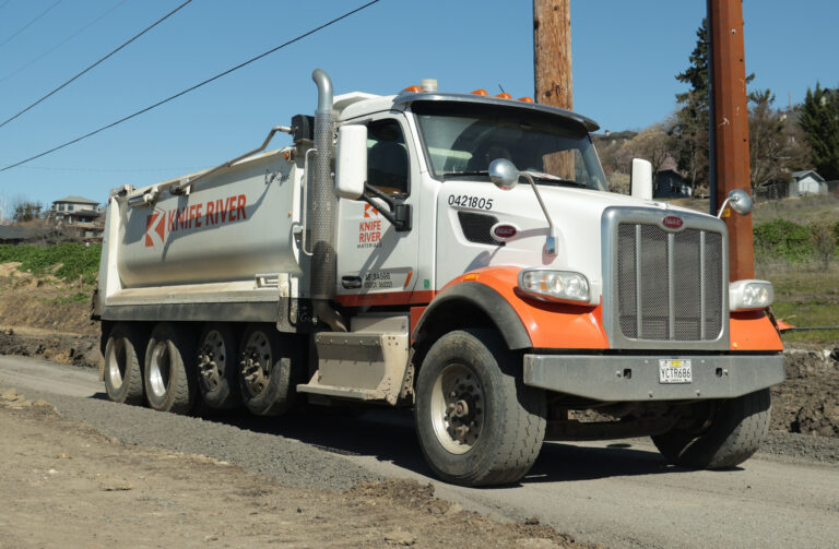 KRM haul truck delivering materials.